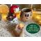 This image shows the battery-operated candle included in your purchase. The candle lights up the carved elf face and has a timer setting.